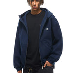 Half-zipped navy blue hoodie on model, showcasing layering versatility and clean hardware details.