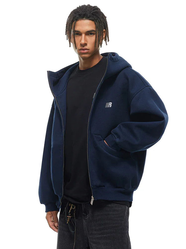 Side view of navy blue baggy hoodie, emphasizing the dropped shoulder and relaxed high-street silhouette.