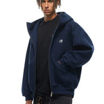 Side view of navy blue baggy hoodie, emphasizing the dropped shoulder and relaxed high-street silhouette.