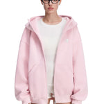 Side view of pink baggy hoodie on model, showcasing dropped shoulders and loose silhouette.